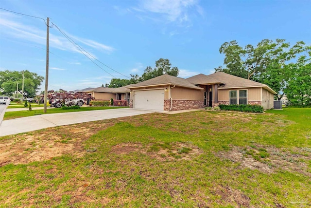5853 Fairlands Rd, Milton, FL 32583 - view of front of house featuring a garage, concrete driveway, and a front yard