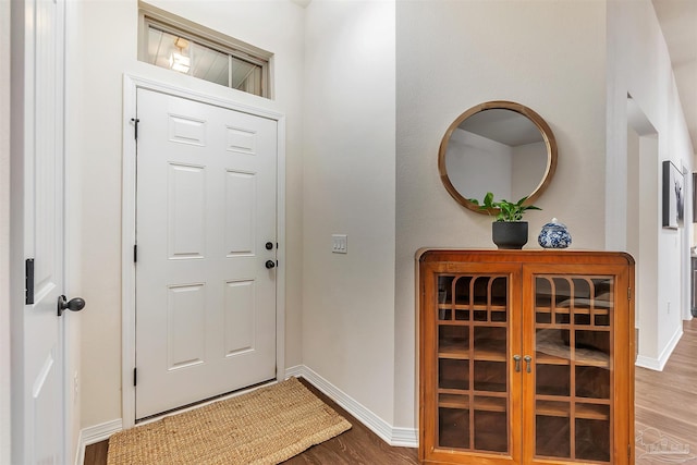 5853 Fairlands Rd, Milton, FL 32583 - foyer entrance featuring wood finished floors and baseboards