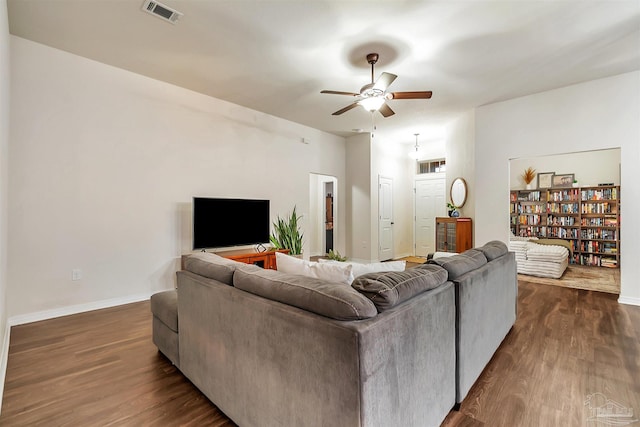 5853 Fairlands Rd, Milton, FL 32583 - living area featuring a ceiling fan, dark wood-style flooring, and baseboards
