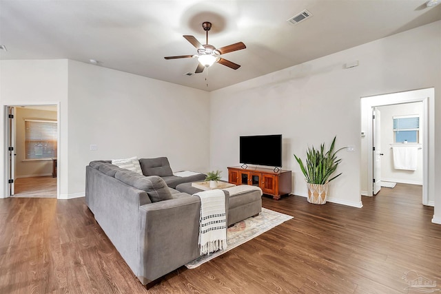 5853 Fairlands Rd, Milton, FL 32583 - living room with a ceiling fan, wood finished floors, and baseboards