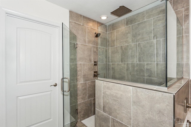 bathroom featuring a shower with shower door