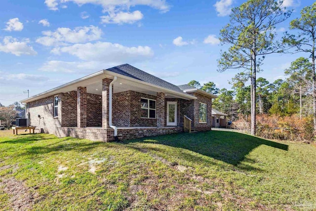 view of property exterior with a yard and cooling unit