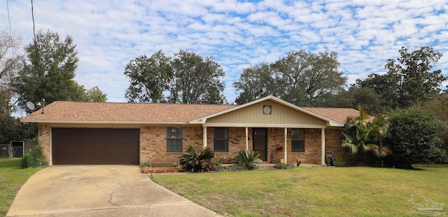 ranch-style home featuring a garage, driveway, a front lawn, and brick siding