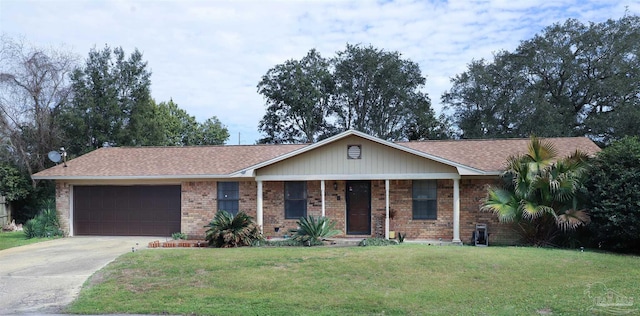 ranch-style home featuring a garage, driveway, brick siding, and a front yard