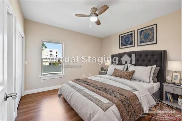 bedroom with dark wood-type flooring and ceiling fan