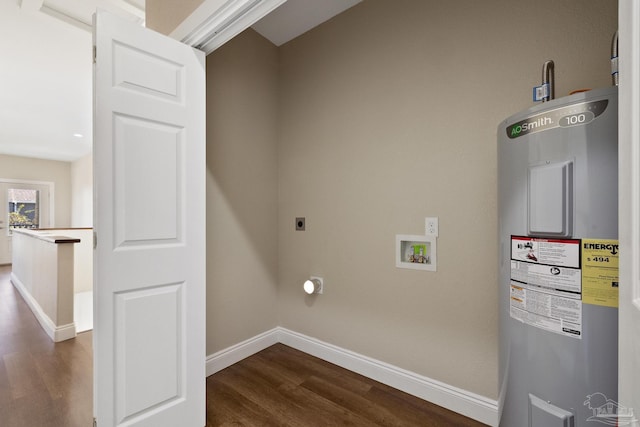 clothes washing area featuring dark wood-type flooring, hookup for a washing machine, and water heater