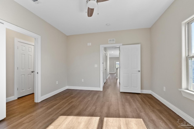 spare room featuring light hardwood / wood-style flooring and ceiling fan