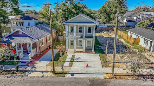 view of front of house featuring a balcony and a porch