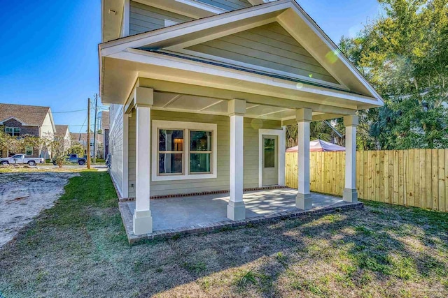 view of home's exterior with a patio and a yard