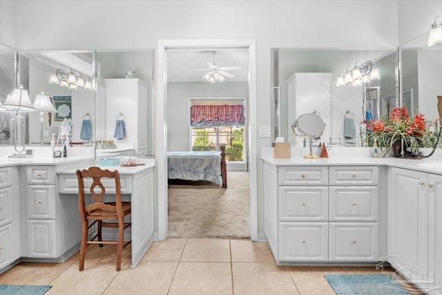 full bath with ensuite bathroom, ceiling fan, tile patterned flooring, and vanity