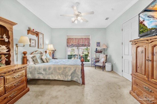 carpeted bedroom featuring crown molding and ceiling fan