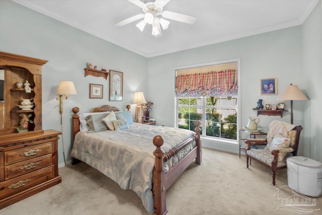 carpeted bedroom featuring ceiling fan and crown molding