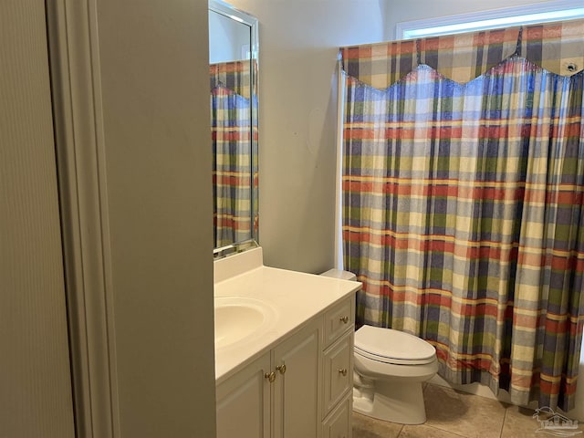 full bathroom featuring vanity, a shower with shower curtain, tile patterned floors, and toilet