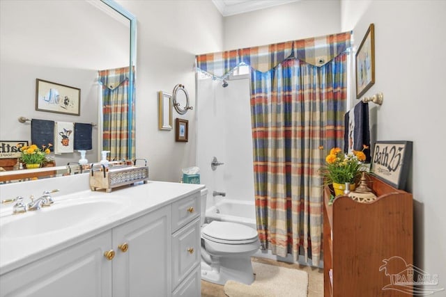 bathroom with crown molding, toilet, shower / tub combo with curtain, and vanity
