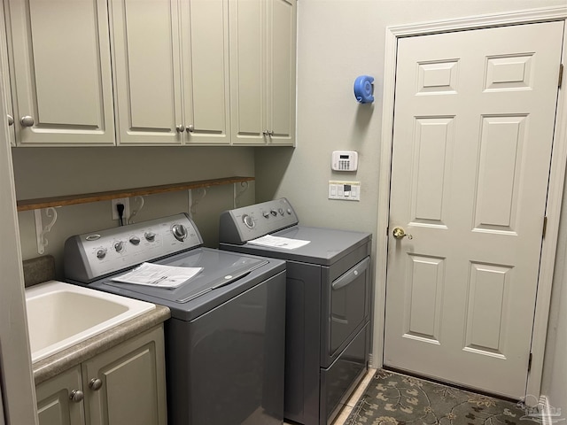 laundry room featuring cabinet space and washing machine and dryer