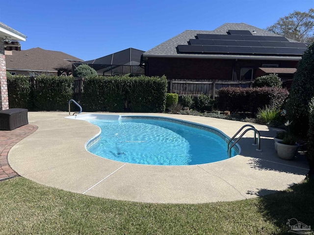 view of swimming pool featuring a fenced in pool, fence private yard, and a patio area