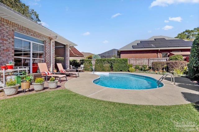 view of pool featuring a yard and a patio area