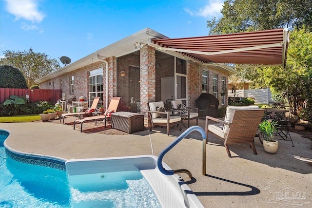 view of pool with fence, a fenced in pool, and a patio