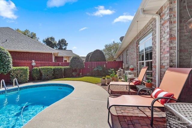 view of pool with a fenced backyard, a fenced in pool, and a patio