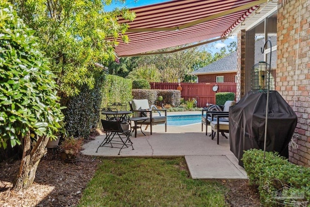 view of patio / terrace with fence and a fenced in pool