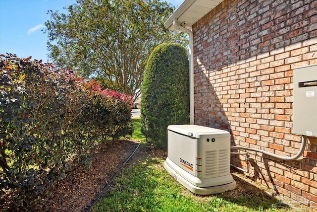 exterior details featuring brick siding and a power unit