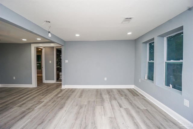 empty room with light hardwood / wood-style floors