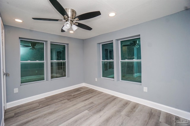 empty room with wood-type flooring and ceiling fan