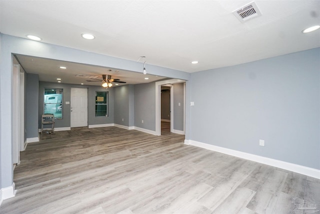 unfurnished living room with light hardwood / wood-style floors and ceiling fan