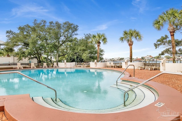 view of swimming pool with a patio