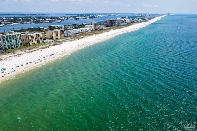 birds eye view of property featuring a beach view and a water view