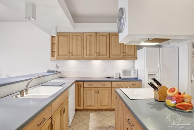 kitchen featuring light tile patterned flooring, white appliances, sink, and light brown cabinetry