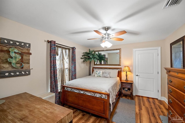 bedroom featuring ceiling fan and hardwood / wood-style flooring