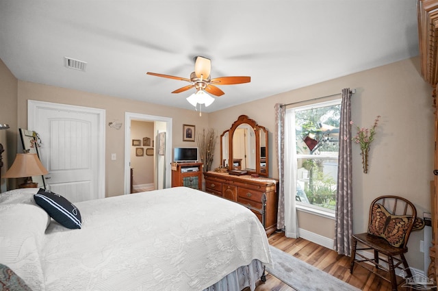 bedroom featuring ceiling fan and light hardwood / wood-style floors