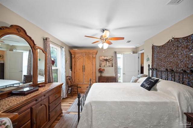 bedroom with ceiling fan and light hardwood / wood-style flooring