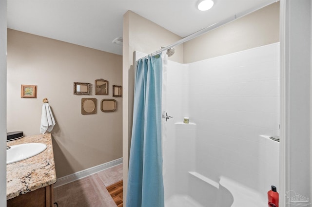 bathroom with vanity, hardwood / wood-style floors, and a shower with curtain