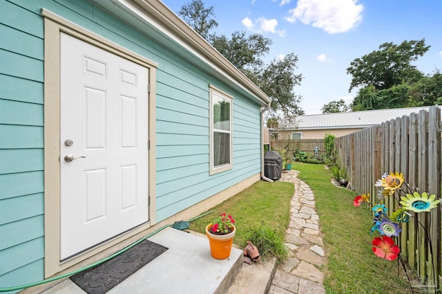 entrance to property with a yard