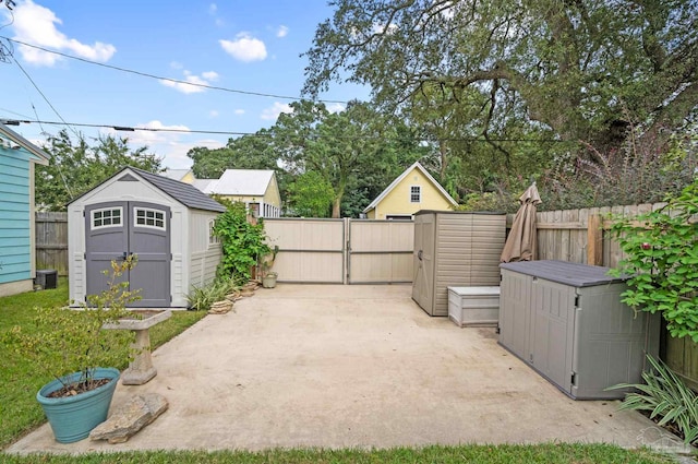 view of patio / terrace featuring a storage unit