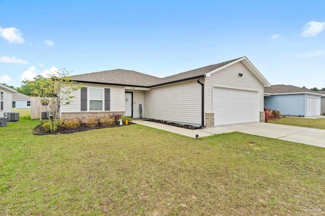 4348 Jitterbug St, Milton, FL 32583 - ranch-style home featuring brick siding, central AC unit, an attached garage, and driveway