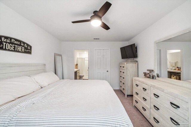 4348 Jitterbug St, Milton, FL 32583 - bedroom with light carpet, ensuite bath, and ceiling fan