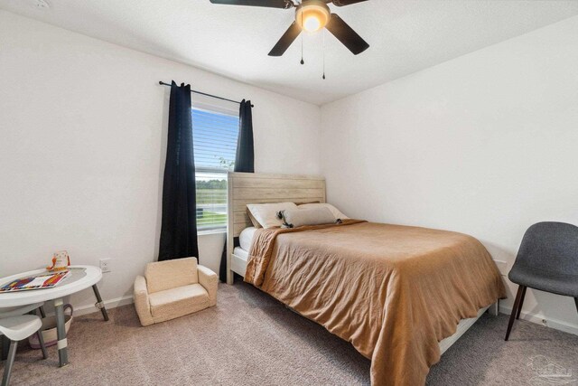 4348 Jitterbug St, Milton, FL 32583 - carpeted bedroom with baseboards and ceiling fan