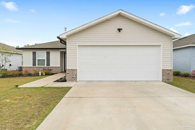 4348 Jitterbug St, Milton, FL 32583 - view of front facade featuring brick siding, driveway, a front yard, and an attached garage