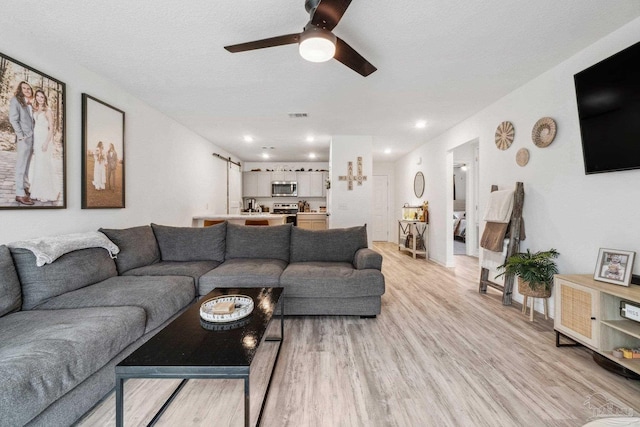 4348 Jitterbug St, Milton, FL 32583 - living room with light wood-type flooring, ceiling fan, and recessed lighting