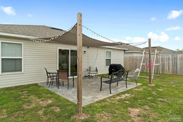 4348 Jitterbug St, Milton, FL 32583 - back of house featuring a patio area and a shingled roof