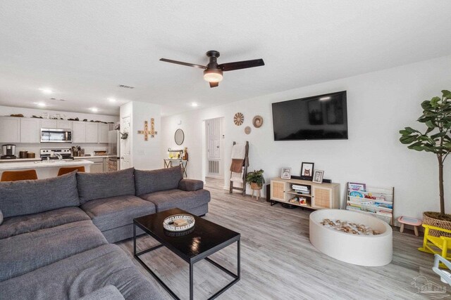 4348 Jitterbug St, Milton, FL 32583 - living area with light wood finished floors, a ceiling fan, recessed lighting, and baseboards