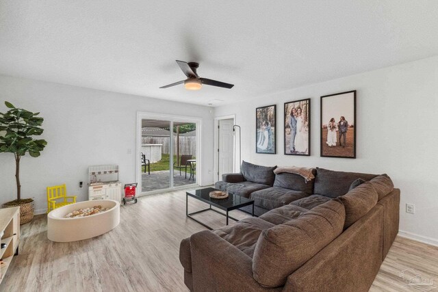 4348 Jitterbug St, Milton, FL 32583 - living room featuring wood finished floors, ceiling fan, baseboards, and a textured ceiling