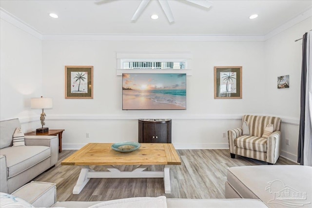 living area featuring recessed lighting, crown molding, and wood finished floors