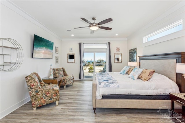 bedroom featuring ornamental molding, access to outside, visible vents, and wood finished floors