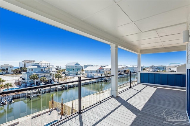 balcony with a water view and a residential view