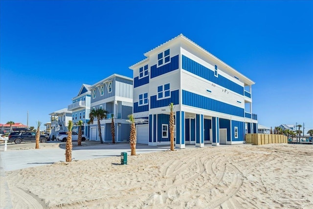 view of building exterior with a garage and concrete driveway