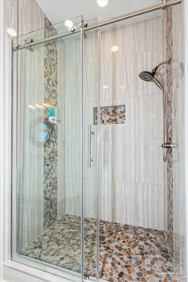 bathroom with a shower stall